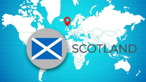 World Map with pin and local flag of Scotland on it.