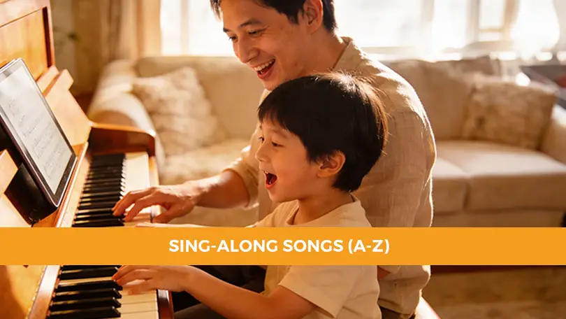 parent and child singing together at piano with kids sing-along songs
